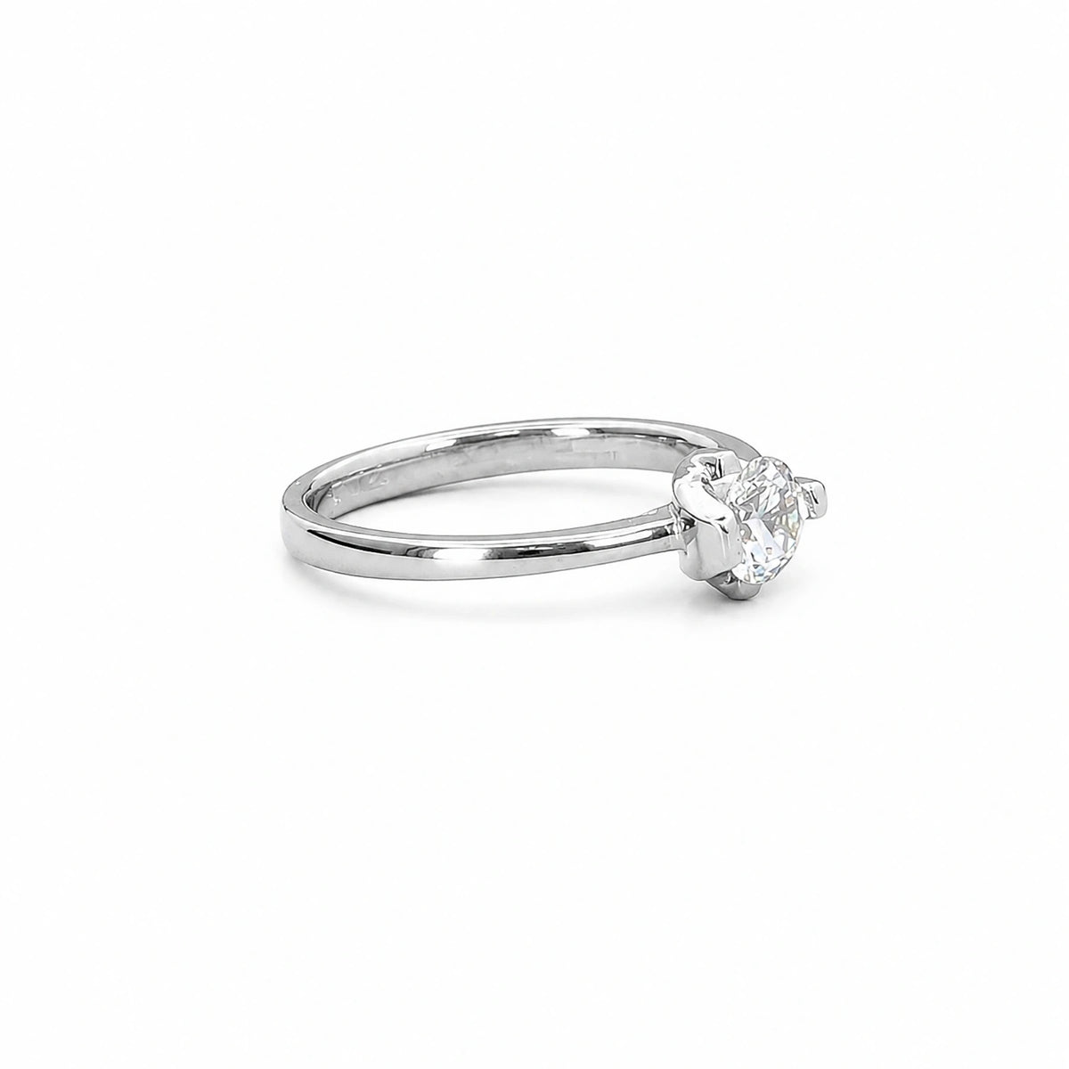 The Alencia Urban Serenade Ribbon Bypass Solitaire Ring